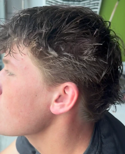 Swept-back natural dark texture and a precise low taper